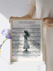 A digital print of the song I Dreamed a Dream from the famous Les Misérables, featuring a girl dreaming in front of the music score.